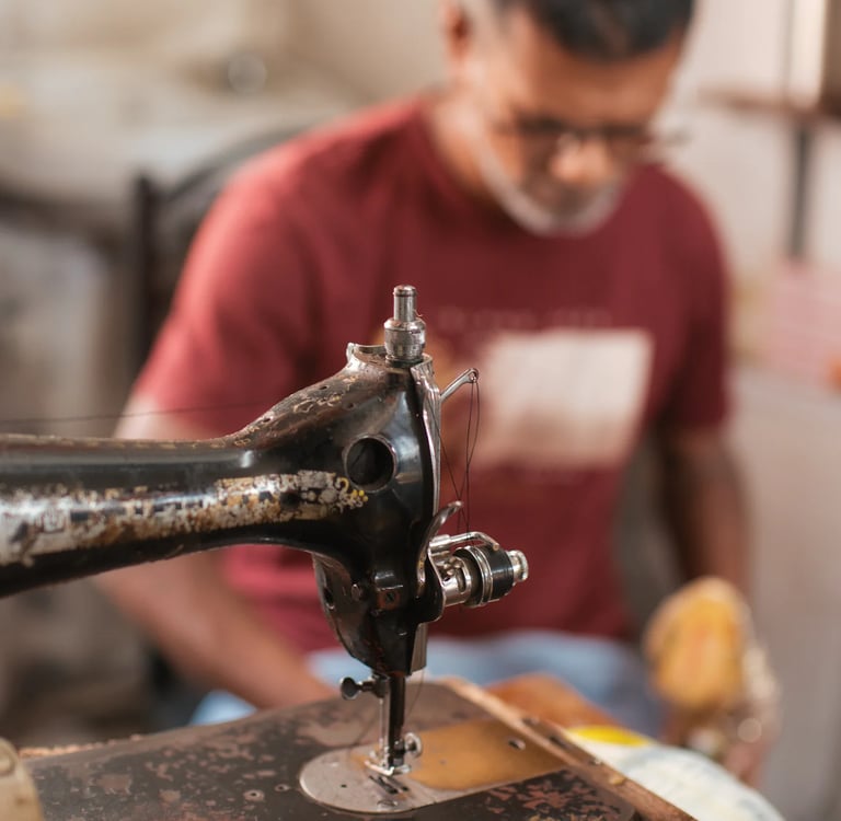 Vintage Singer sewing machine in cobbler workshop, Mahebourg Royal Road, Mauritius