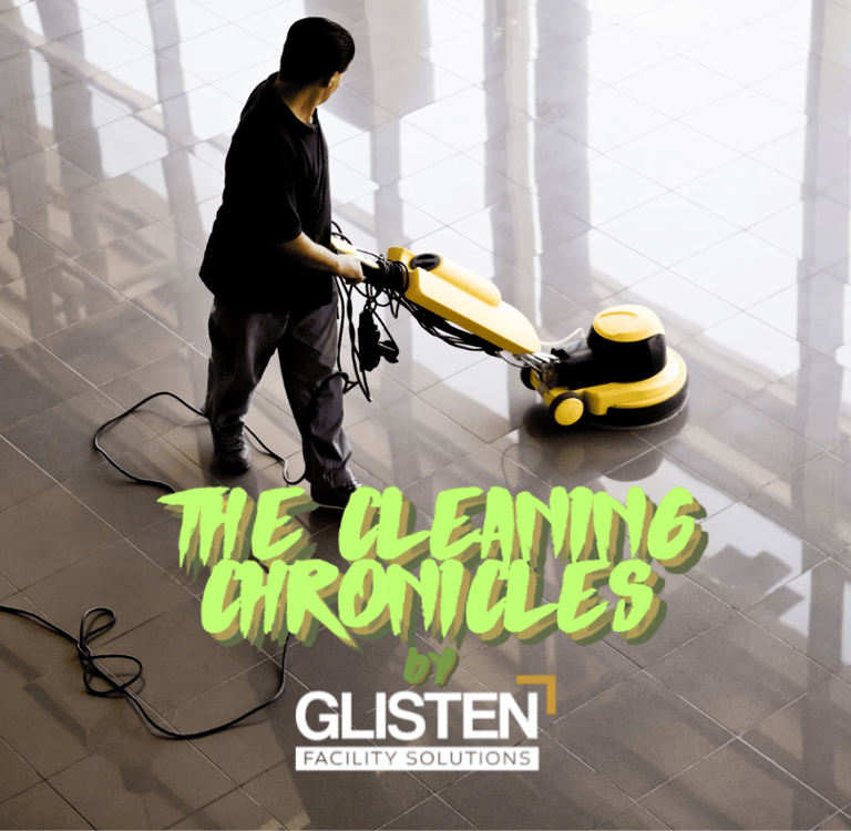 A clean, modern lobby with a janitor polishing floors.