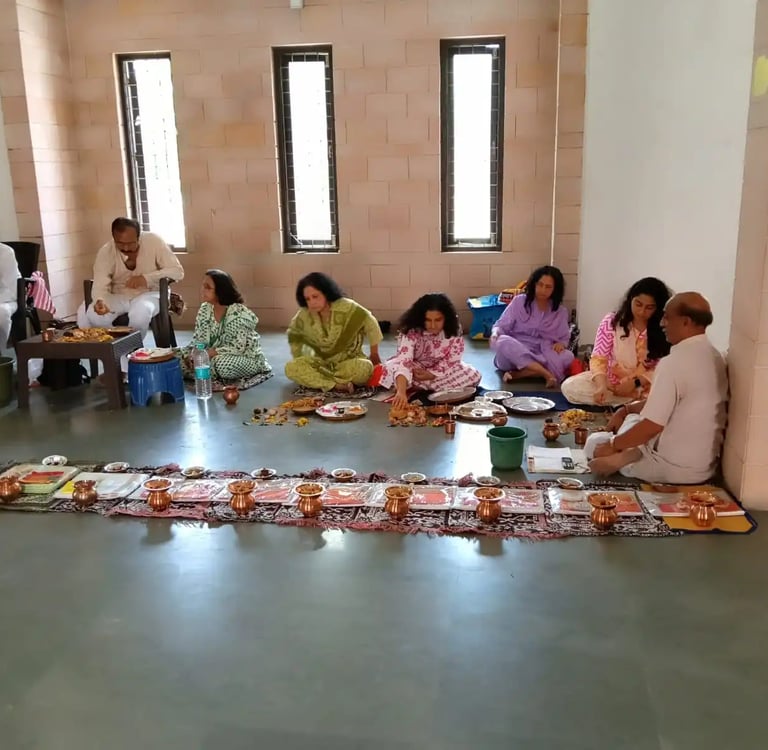 Extended Hindu family performing Matrugaya Shraddh Pooja with copper kalash arrangement at Bindu Sarovar Siddhpur