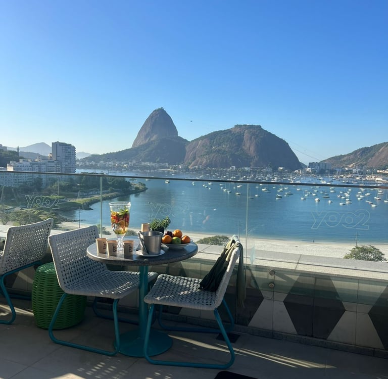 a table with a tray of food and a bowl of fruit