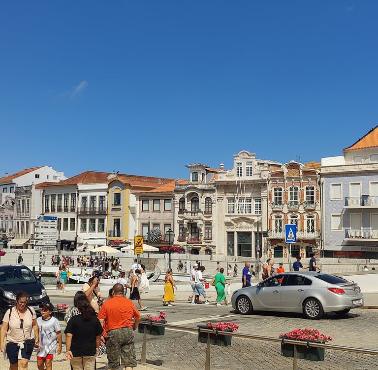 a group of people standing around a city street
