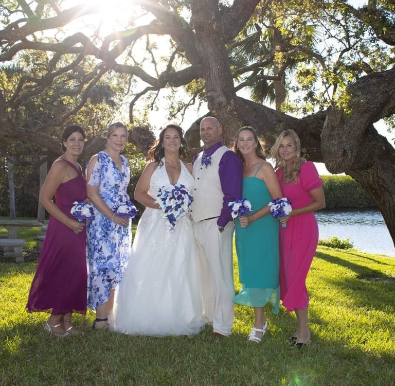 a bride and groomsmid posing for a photo