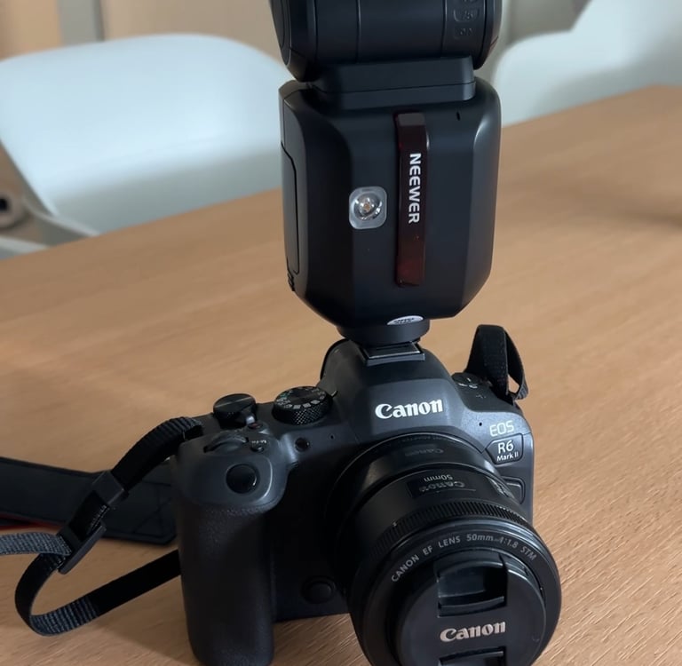 a camera flasher on a table with a flasher