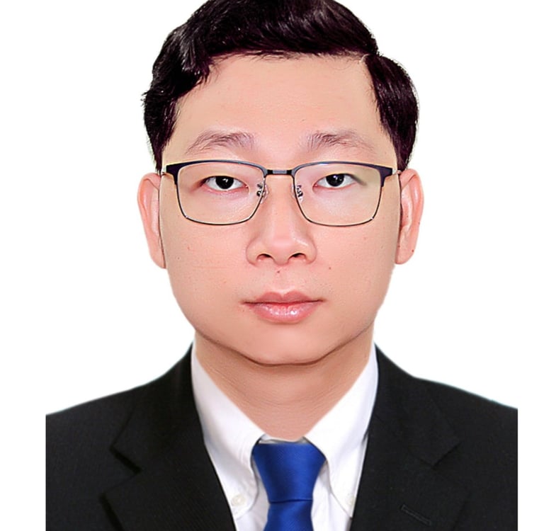 a man in a suit and tie with glasses