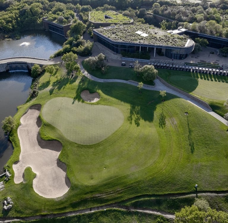 An aerial view of the 9th green and clubhouse at The Club at Steyn City, host venue of LIV Golf Sout