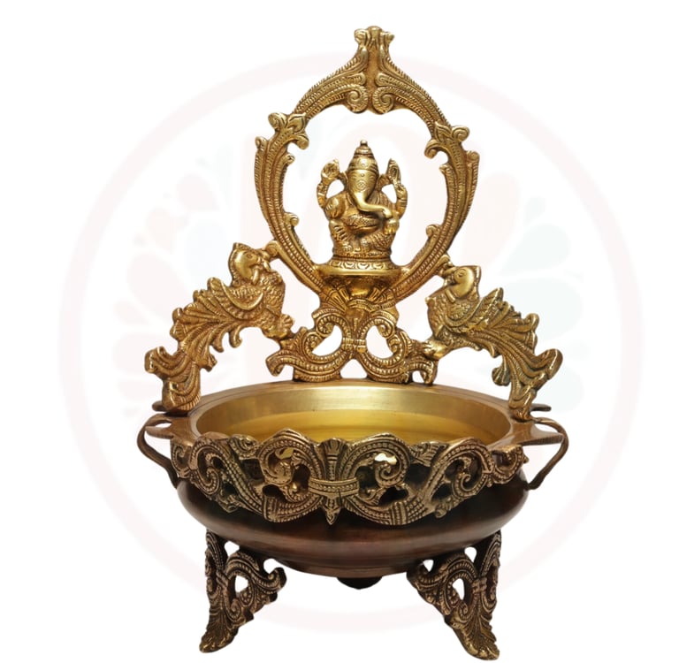 a gold plated bowl with a gan ganesh ganesh statue