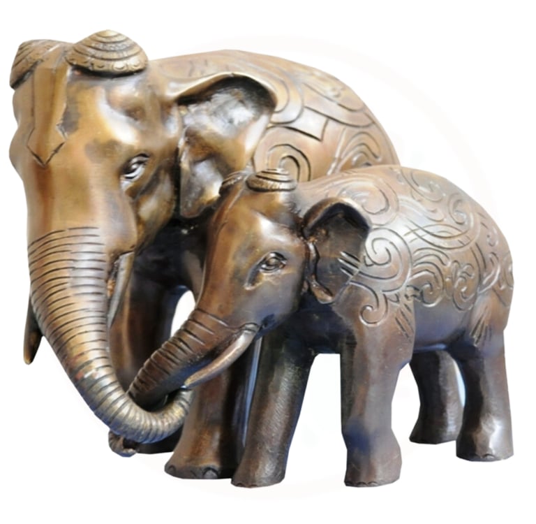 a pair of elephants standing next to each other