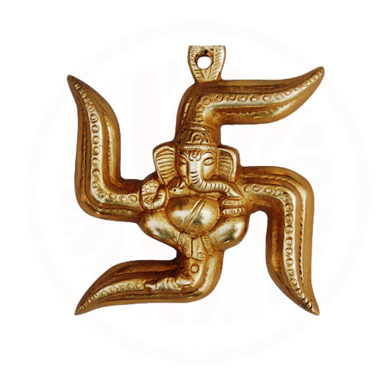 a gold colored pendant with a large gold colored figure