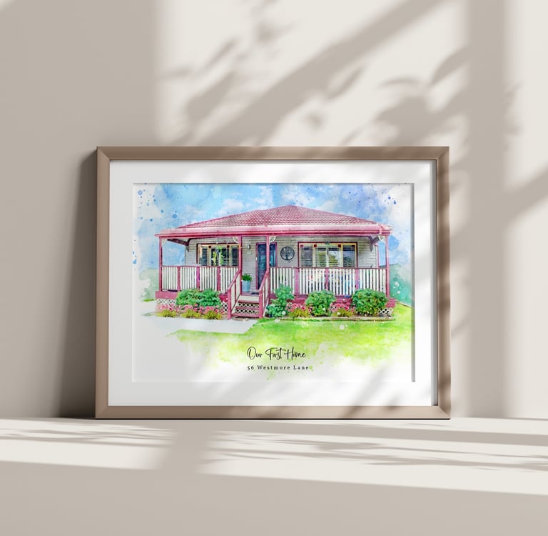 Framed watercolour painting of a house leaning against the wall with shadows