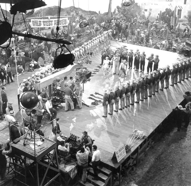 Mickey Rooney and Judy Garland dance “I Got Rhythm” as Berkeley’s camera captures a V‑shaped cowboy 