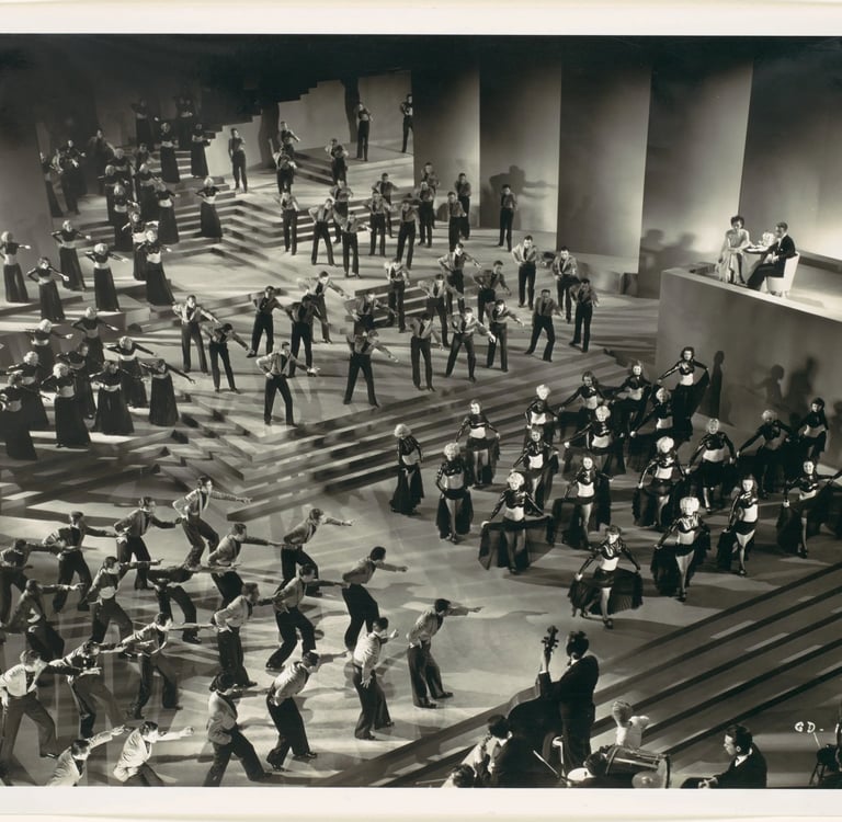 Overhead three‑quarter shot of Gold Diggers of 1935 “Lullaby of Broadway” with dancers in grouped fo