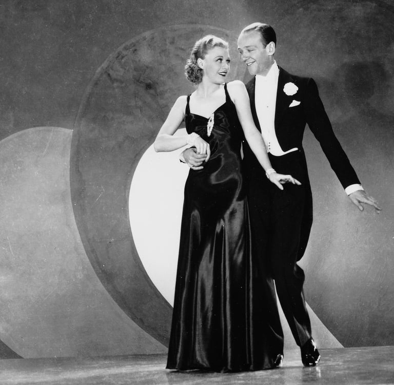 Astaire and Rogers pose in formalwear for a Swing Time publicity still, 1936