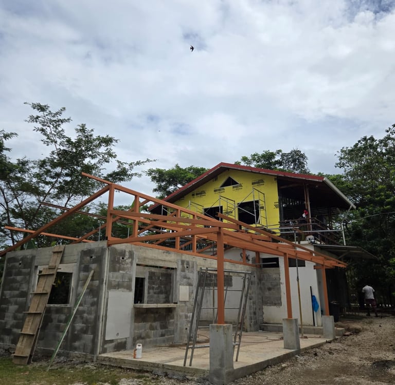 Complete home renovation in progress, steel framing and raw concrete walls