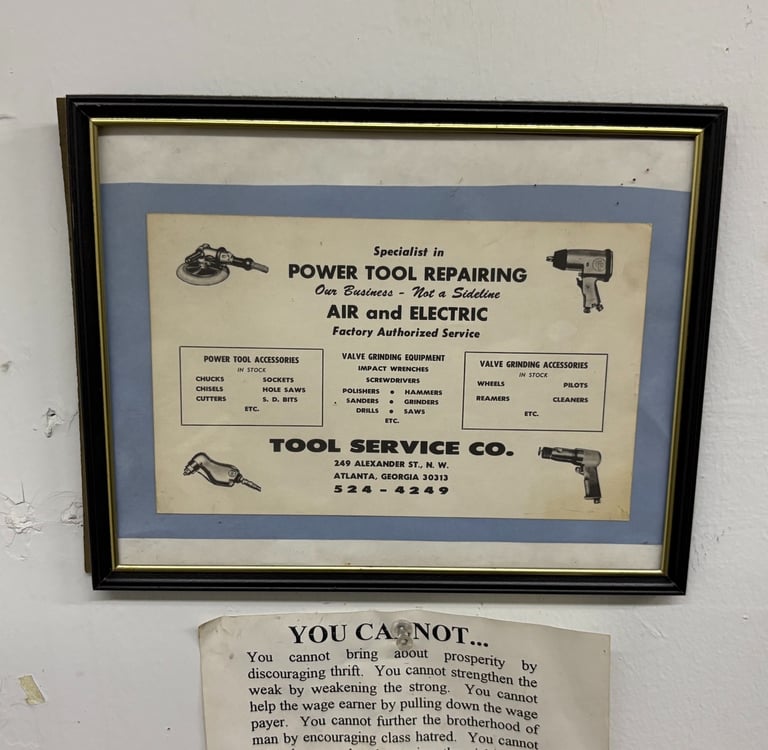 Vintage framed advertisement for a power tool repair shop specializing in air and electric tool service.