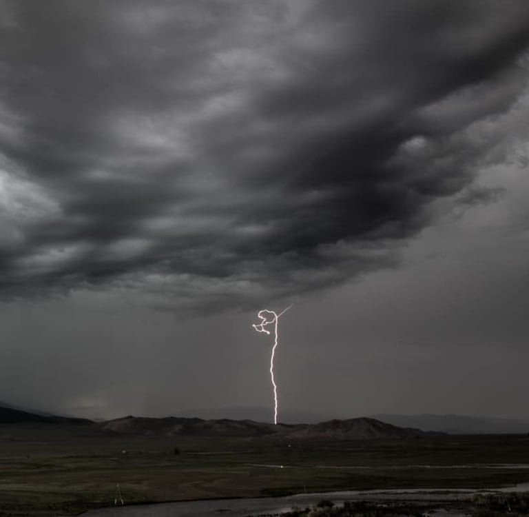 lightning striking over the mountain steppe