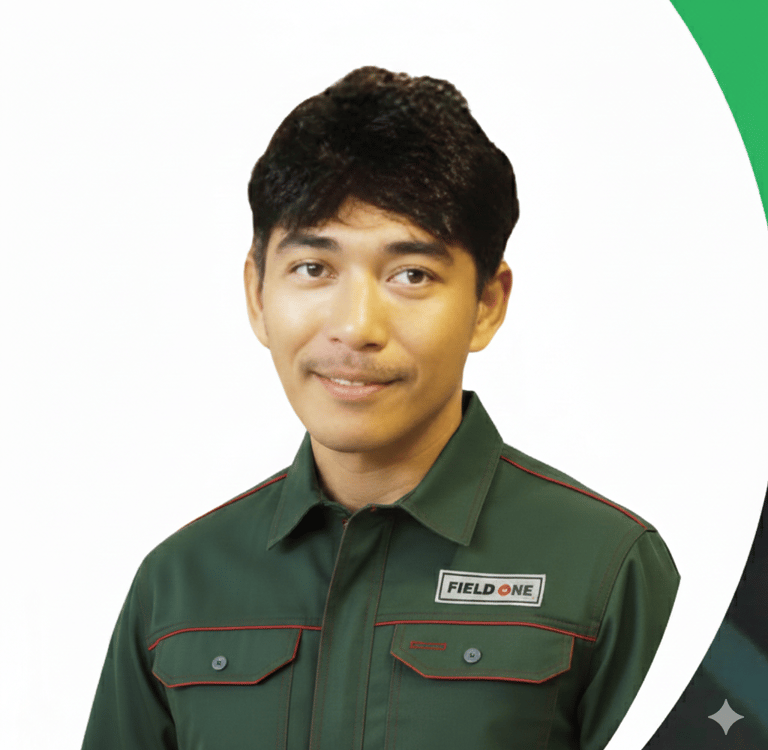 Professional Field One service technician smiling in a green company uniform