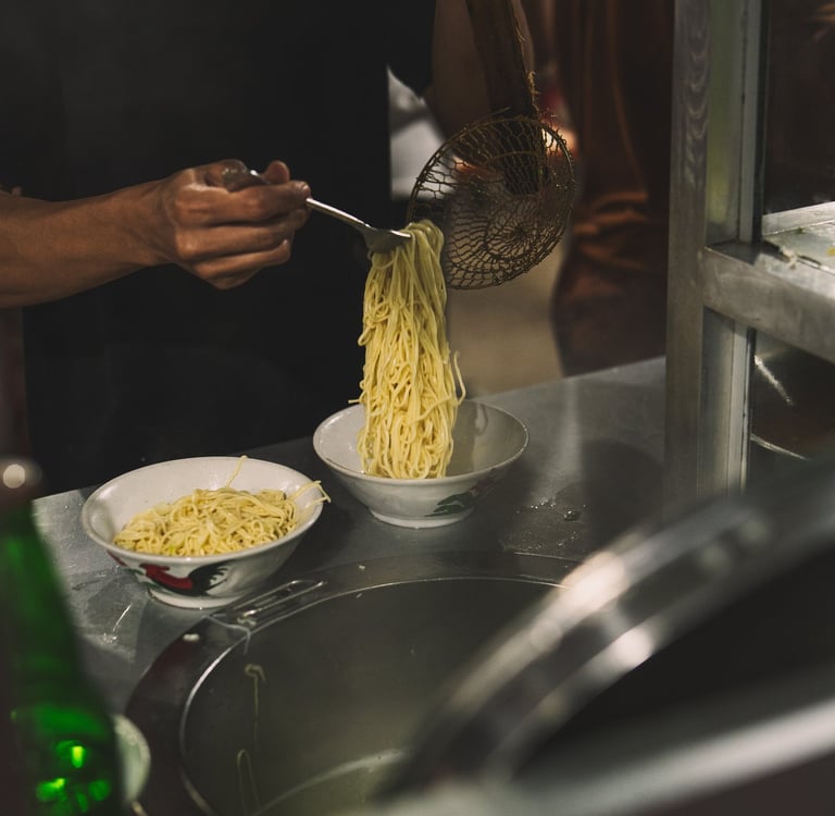 Chef preparing mie ayam at Langgeng Mie Ayam Bakso Batam