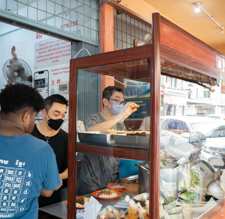 People preparing Non-Halal Nasi Kari at Nasi Kari Ali Batam