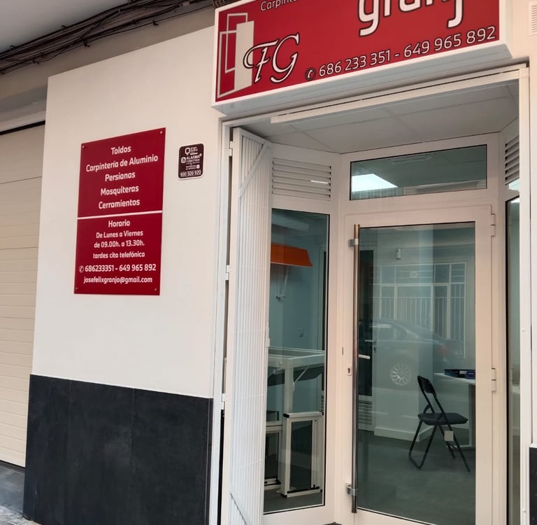 Granjo workshop storefront for aluminum carpentry, blinds, and awnings in Spain.
