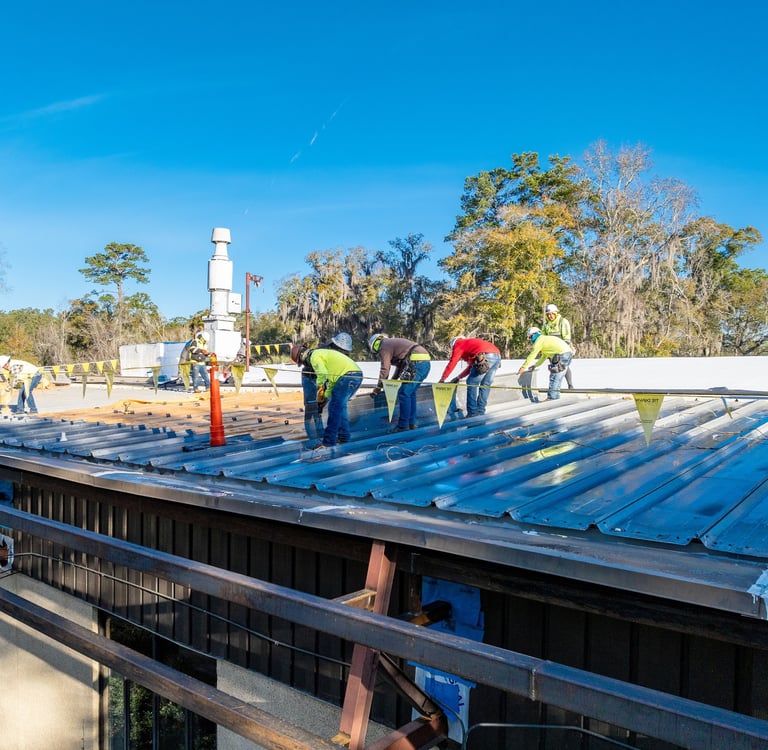 Workers replacing a roof
