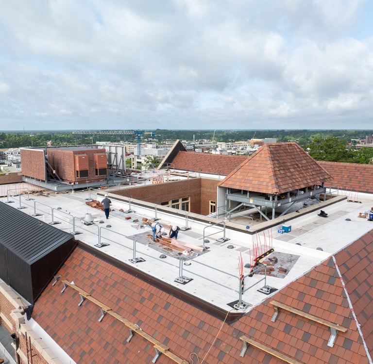 Workers replacing a roof