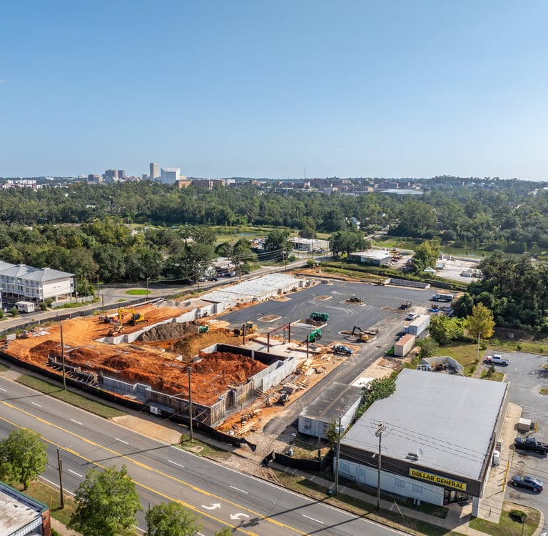a large building with a lot of construction materials and a lot of construction equipment