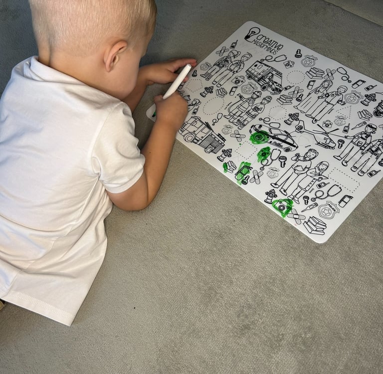 Toddler using a Scribbly Kids reusable drawing mat at home for creativity and screen-free play