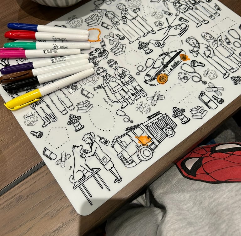 Child learning about doctors and firefighters on Scribbly Kids Community Heroes mat