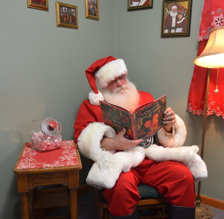 Santa Tom reading a storybook 