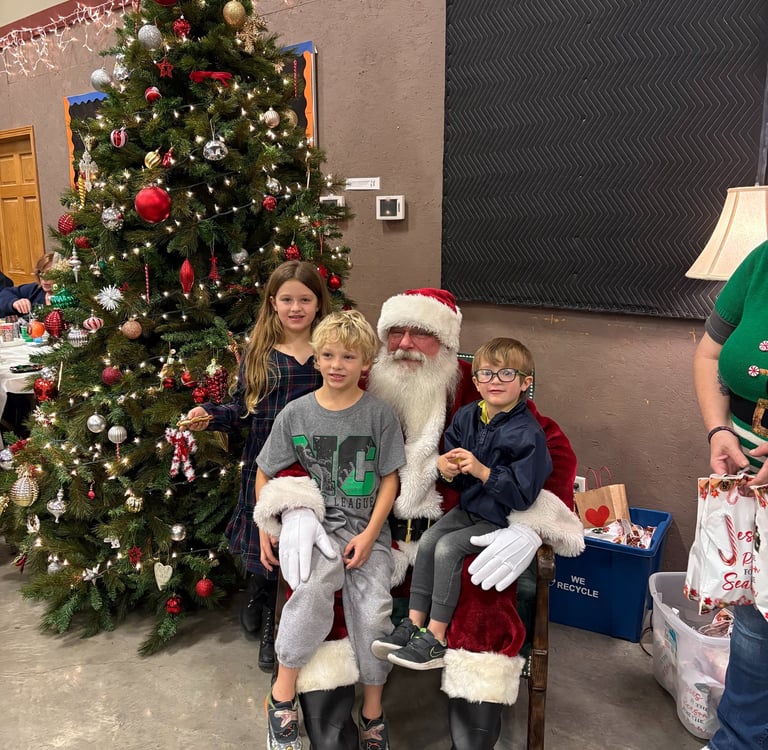 Santa Tom with three children