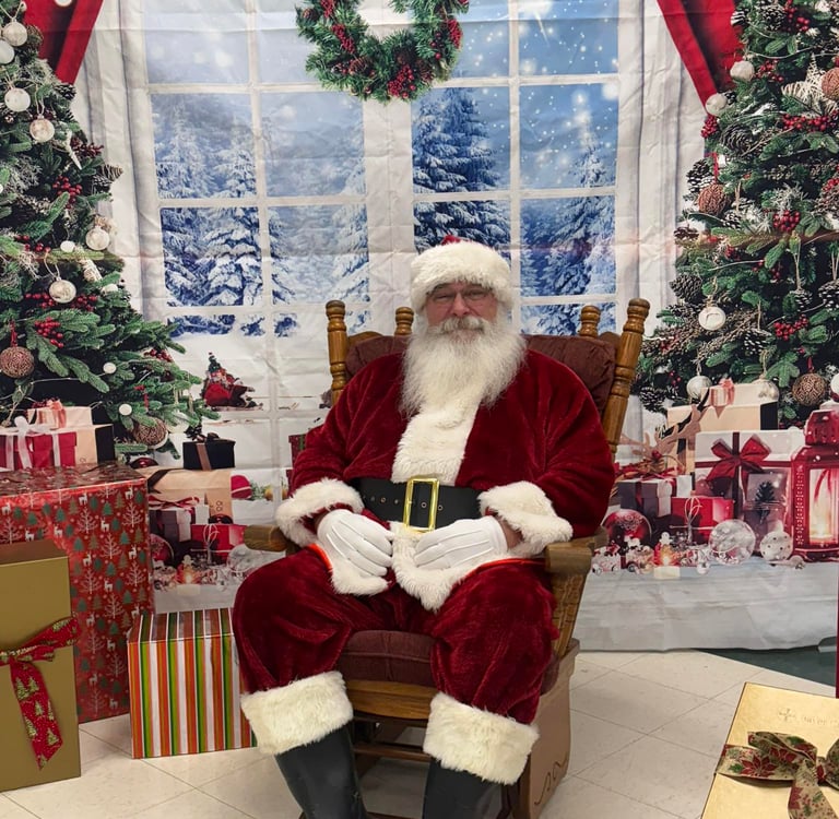 Santa Tom sitting in a rocking chair
