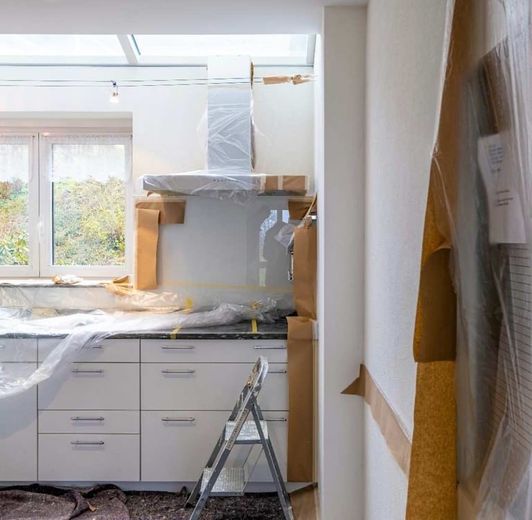 Home improvement contractor reviewing kitchen renovation plans with a Columbus Ohio homeowner