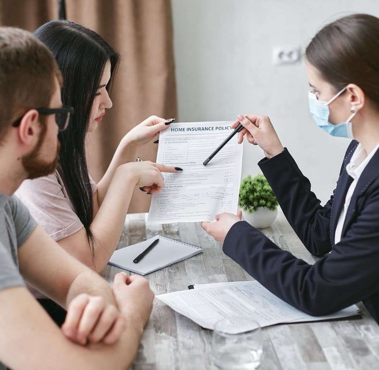 Insurance agent consulting with clients at a Chattanooga Tennessee insurance agency office