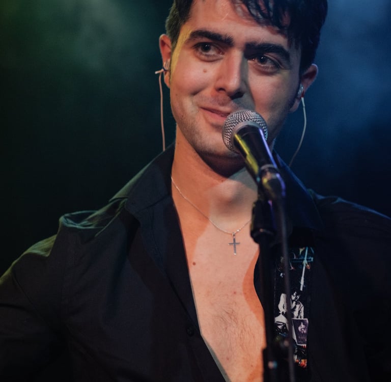 Olly Williams live rock and roll singer performing on stage