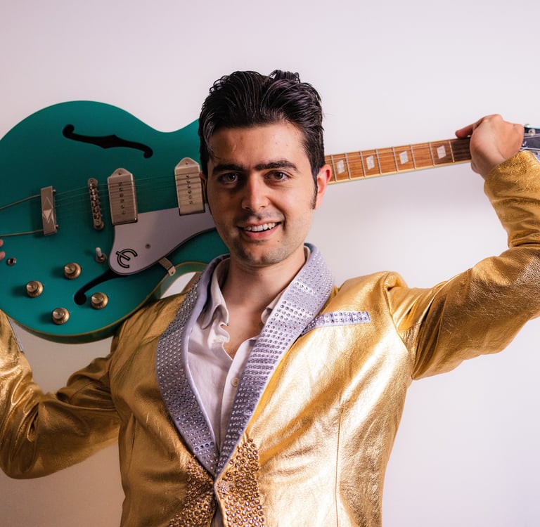 Brighton UK singer songwriter Olly Williams promotional photo with electric guitar