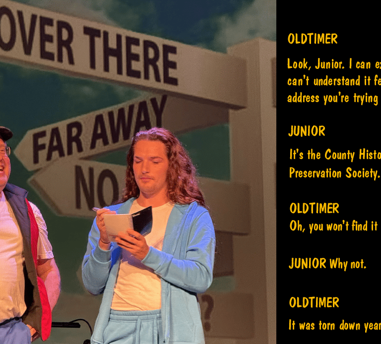 Two actors performing comedy skit about places that have been torn down