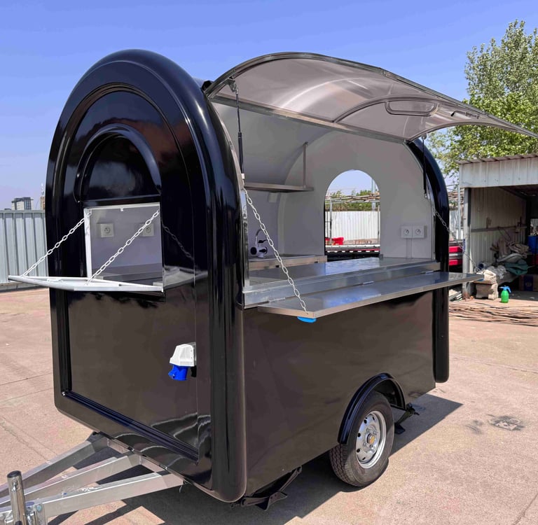 Foodtruck demi-rond TF-DM Classic couleur RAL noir foncé, finition lisse, coque en fibre de verre et châssis galvanisé, certi