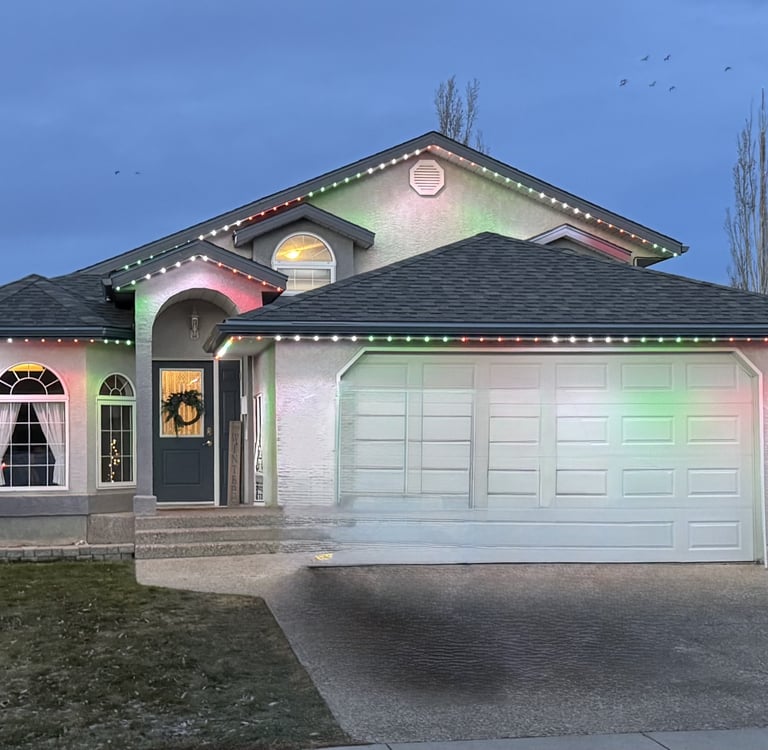 Festive Holiday lighting on a residential home front yard.