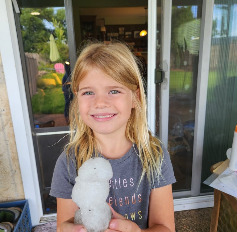Mary Grace holding a snowman called Snowflake