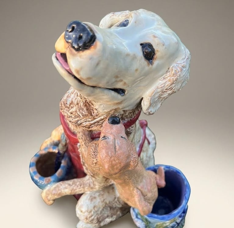 Hand-sculpted ceramic Golden Retriever artist sculpture in warm honey glazes.