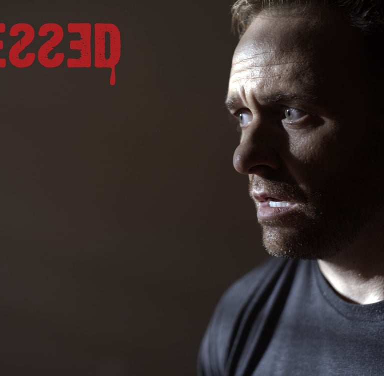 a man with a beard and a black shirt
