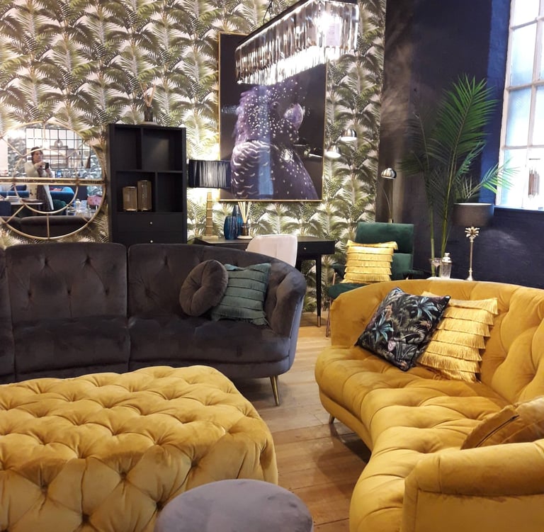 a living room with sofas and a large window