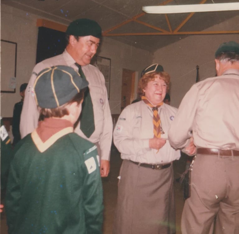 cub and scouts leaders in a hut