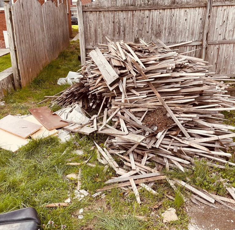 Old wooden fence removal and backyard hauling.