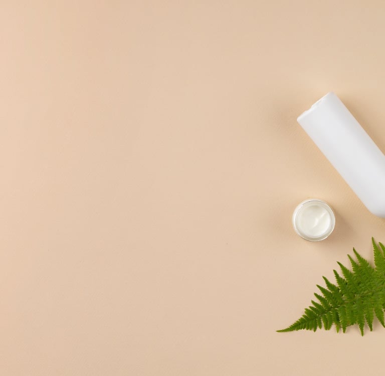 cosmetics with beige background and tree leafs
