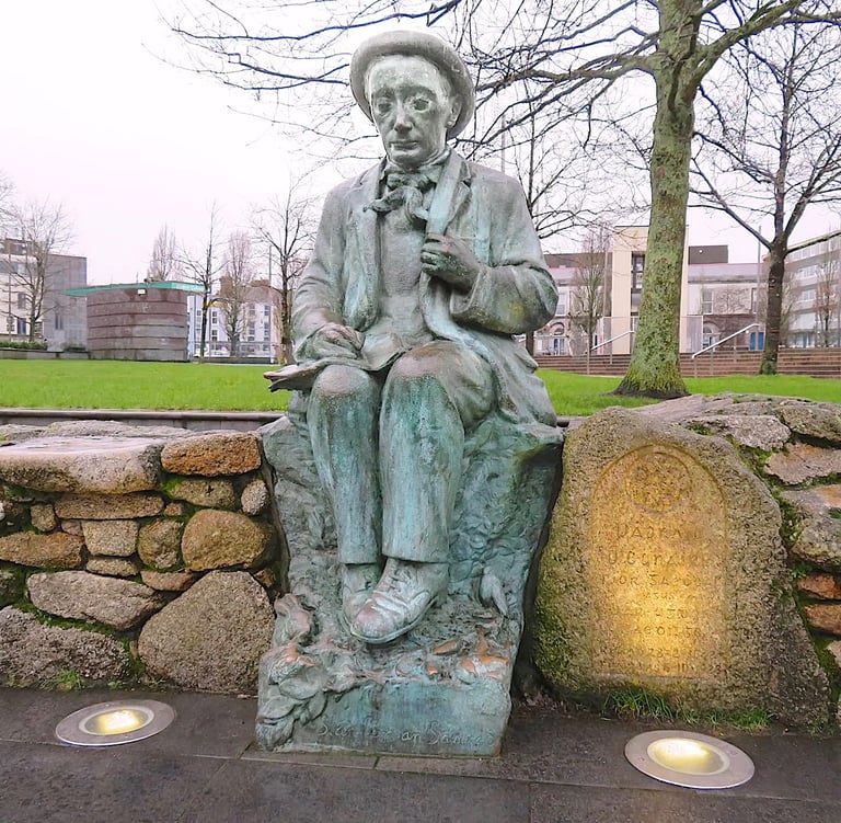 Bronze replica sculpture of Irish author Pádraic Ó Conaire, located in Eyre Square, Galway