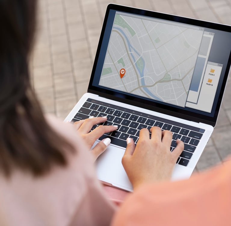Customer doing a local business search for businesses in their area on a laptop outside.