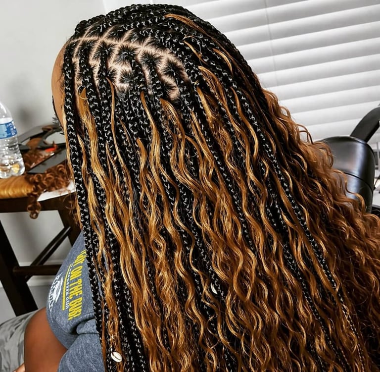 A woman with brown and black goddess braids
