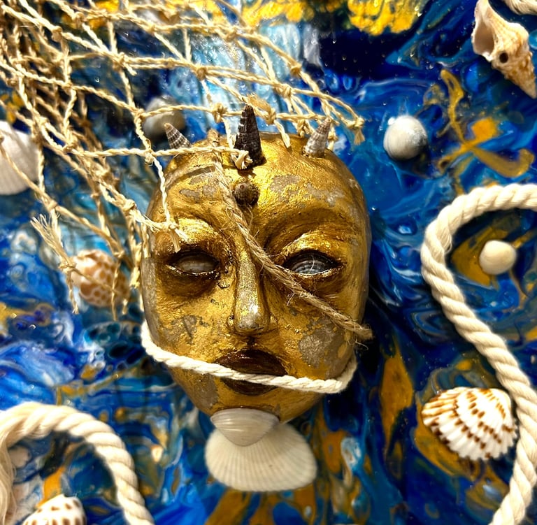 a gold mask with a gold face