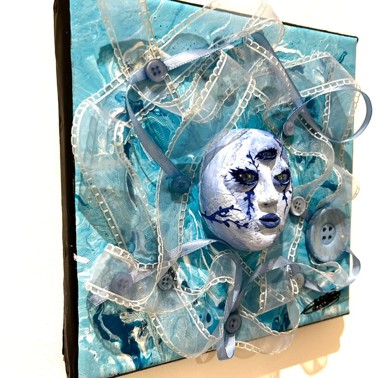 a painting of a face with a blue face and tissus